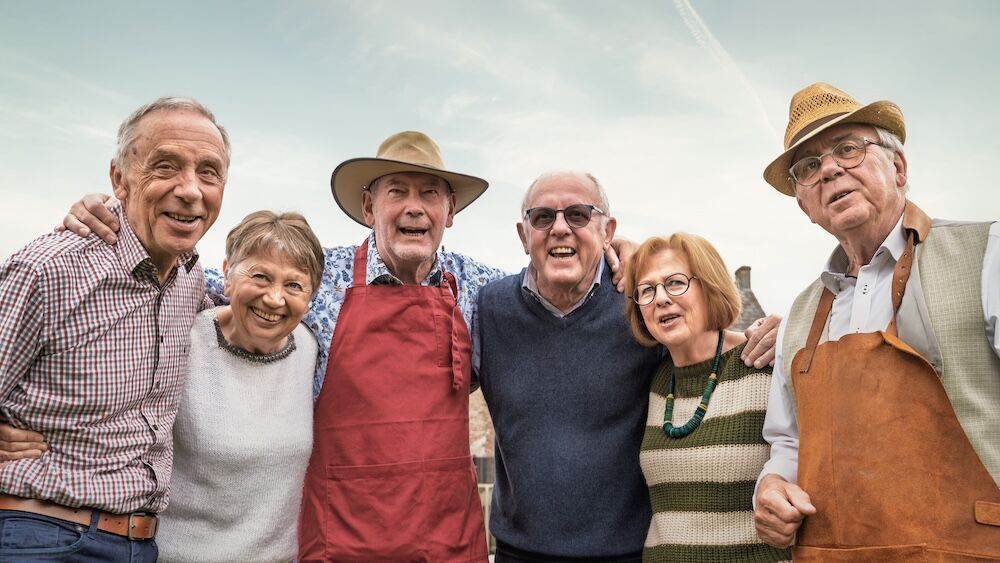 Group of senior friends outside enjoying life at independent living rancho mirage