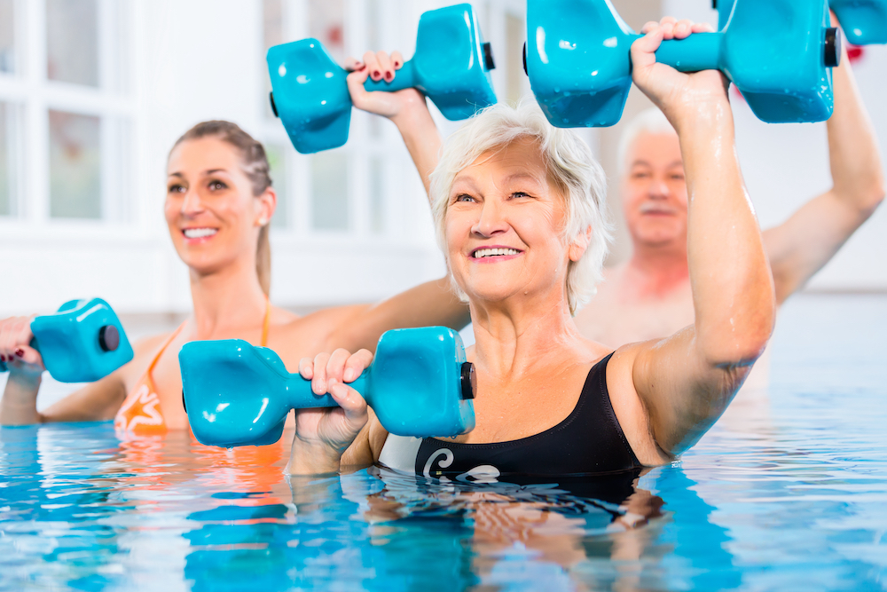 A senior woman doing pool exercises