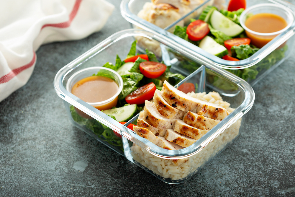 Meal prep containers filled with healthy foods