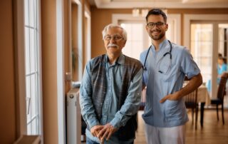 A senior man and doctor take a walk through Rancho Mirage senior living