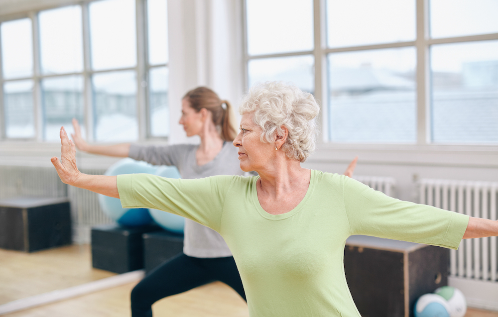 A senior woman doing a yoga workout