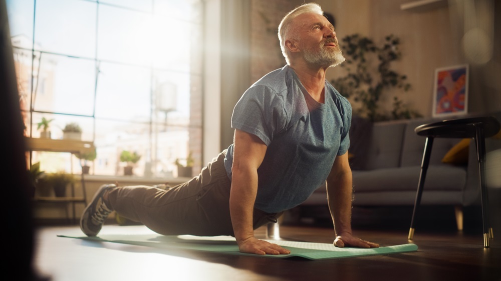 A senior man practicing yoga and mindfulness